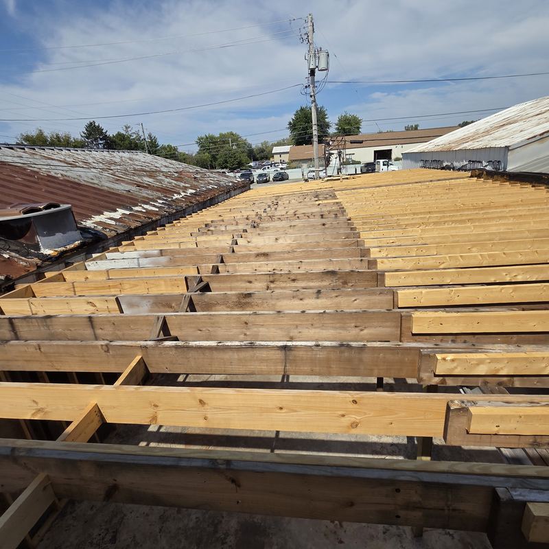New roof joists going in across a commercial building
